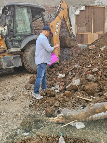 Performing a bhoomi poojan (ground-breaking ceremony) ritual on a new plot. This is an important step to honor the land and set a positive intention before construction.
