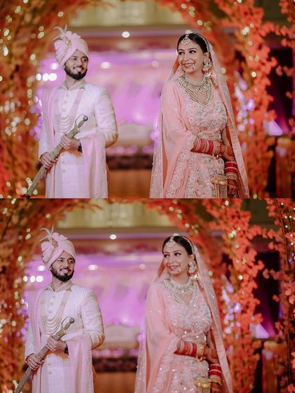 A lovely portrait of the couple framed by a floral archway at their Jammu wedding. The vibrant colors and their happy expressions make this a perfect wedding photo.