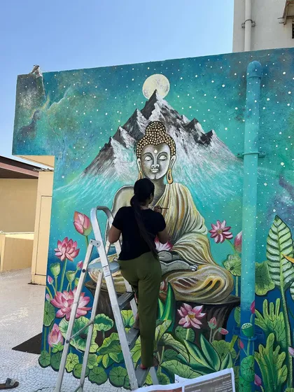 Another action shot of me bringing this peaceful terrace mural to life.