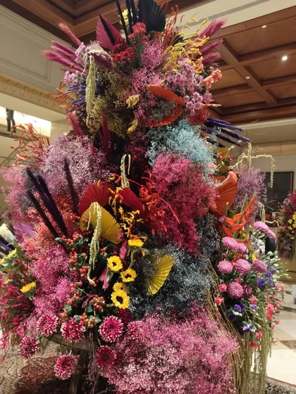 Another angle of the Holi installation, highlighting the rich layers of texture and color. From deep purples and sunny yellows to bright pinks, every hue comes together to create a visual symphony that brightens the entire space.