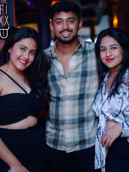 A great shot of some friends enjoying the party at The Fixx. The more, the merrier!