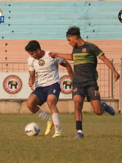 Our captain skillfully maneuvers past a challenger, maintaining possession for the team.