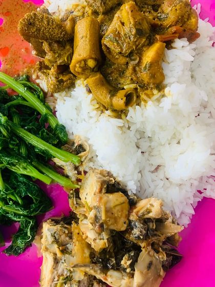 A close-up of the thali, showing the rich beef innard curry.