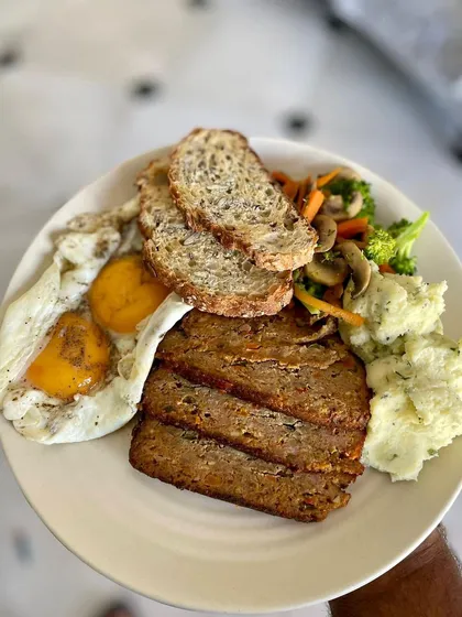 This is how one of my customers enjoys the pork meatloaf for a power packed breakfast. It’s served with runny eggs, sautéed veggies, multigrain sourdough, and creamy mashed potatoes.