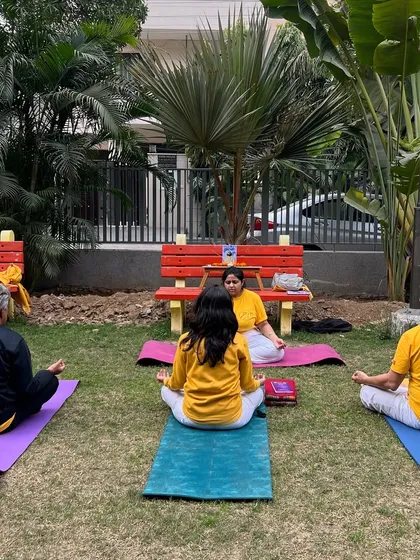 A student teacher guides her small group through a meditation practice outdoors. We encourage practical, hands-on teaching from day one.