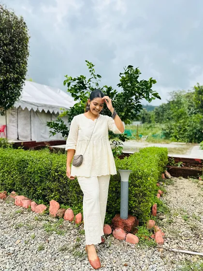 A candid moment showing how effortlessly this little bag fits into a relaxed and comfortable look.