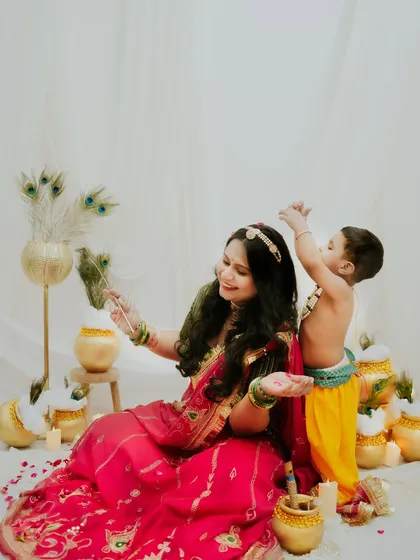 A playful moment between Maiya and her Kanha. The peacock feather adds a perfect touch to this beautiful scene.