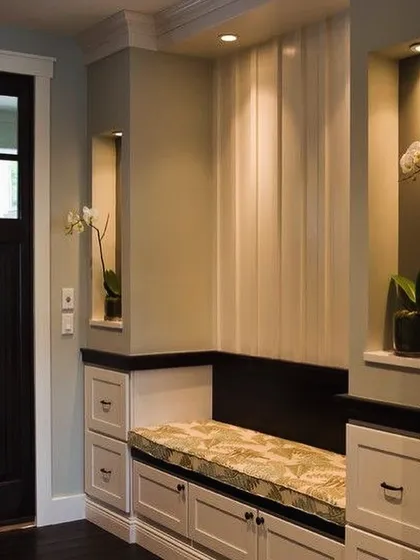 For this home in Asiad Village, I designed a welcoming entryway with a custom cushioned bench and integrated storage. This small detail adds immense practicality and sets a warm tone for the entire house.