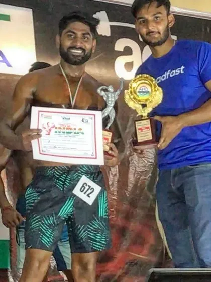 Holding my trophy and certificate. This is a reminder that with hard work, you can achieve your goals.