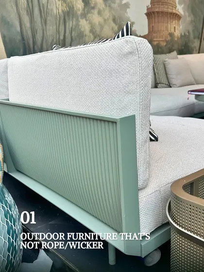 A close-up of modern outdoor furniture featuring a sleek, powder-coated aluminum frame. This type of furniture is not only stylish but also incredibly durable and resistant to the elements, making it a great investment for any outdoor space.
