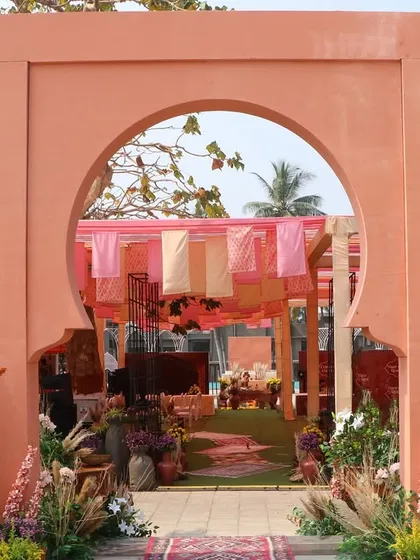 The grand entrance to the 'Souk Bazaar' Haldi, featuring a Moroccan-style arch that perfectly frames the vibrant event space within.