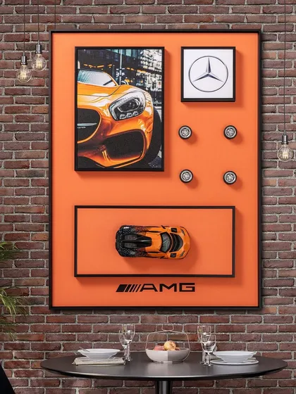 For the ultimate car enthusiast, we created this shadow box celebrating the iconic Mercedes-Benz AMG. It features a detailed miniature car model, the classic logo, and other 3D elements against a vibrant orange background, perfect for an office or study.