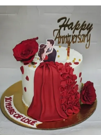 Celebrating 10 years of love with this beautiful anniversary cake. It's a fresh pineapple, eggless cake decorated with a red fondant skirt and fresh roses.