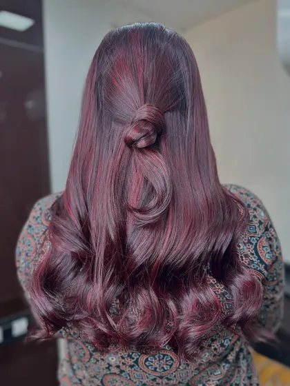 The half knot style is perfect for showcasing the deep red and cherry tones in this beautiful color job.
