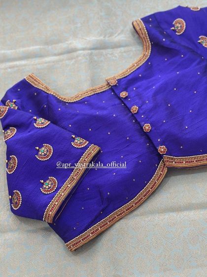 The front view of the royal blue blouse, showing the button details and neckline.