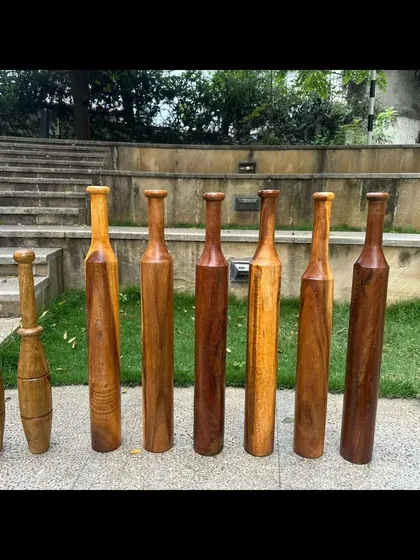 A lineup of some of the Indian clubs and Mugdars we use in our workshops, showing the variety in size and shape.