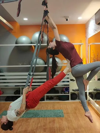 Teamwork makes the dream work, especially in our partner aerial sessions. This pose requires trust, balance, and communication, making it a fun and challenging way to connect with a friend while getting an incredible workout.