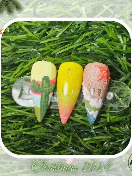 A playful and creative set of nails with a desert theme, including a cactus and beach scene, all crafted by a student.