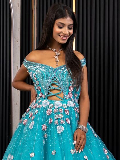 Another angle of the blue ball gown, highlighting the lace-up corset detail on the bodice. It's these small details that make my rental outfits special.