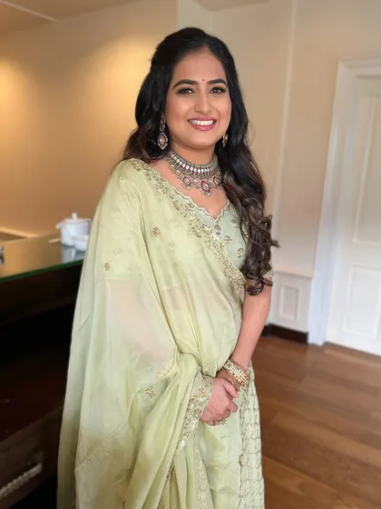 Keeping it light, radiant, and picture-perfect for her big 'Yes' moment in a lovely sage green outfit.