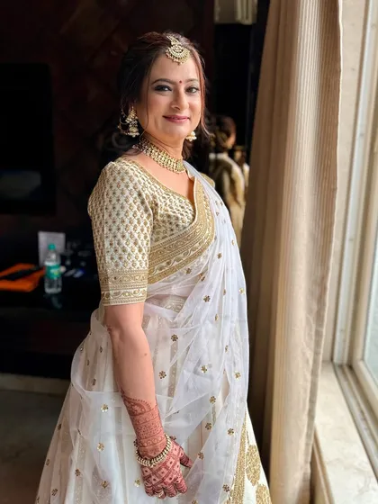 Created magic on skin that carries wisdom and grace. This look in a classic white and gold outfit is timeless and elegant.