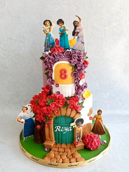 We don't talk about Bruno, but we do talk about this Encanto cake! I loved working with the vibrant colours of the movie, creating the magical Casita with sugar flowers and edible images of the Madrigal family.
