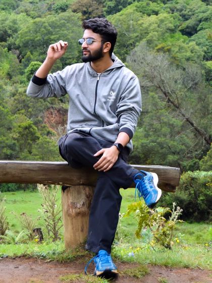 Chilling on a wooden bench surrounded by Ooty's greenery. It's the perfect place to unwind.