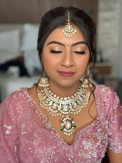 A close-up of the pastel bride's eye makeup. The look is soft and shimmery, with neutral tones and a sharp liner to define the eyes beautifully.