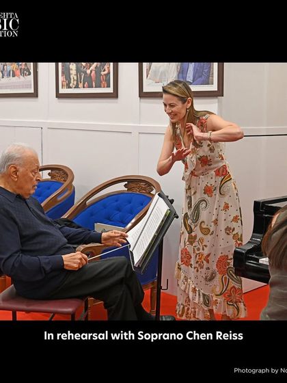 A candid moment during rehearsal with soprano Chen Reiss and Maestro Zubin Mehta, showcasing the collaborative process of preparing for a major concert.