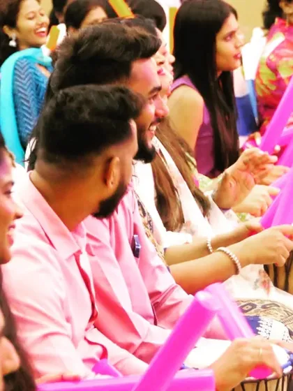 A close-up of the team's engagement during a musical boomwhacker and drum jam session for Suryoday Bank. I focus on capturing individual expressions of joy and teamwork during corporate activities.