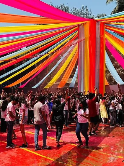 This is the kind of energy I bring to large-scale festival setups. For the 'Rang De' Holi bash at Dadar's BMC Ground, I created this massive overhead canopy with vibrant, multi-colored draping that covered the entire party area, making the event a huge success.