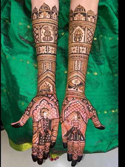 A full-length view of a stunning portrait mehandi. The bride and groom figures are drawn with precision, set against a backdrop of intricate patterns and symbolic motifs.
