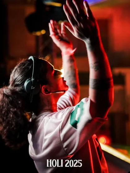 A powerful shot from a Holi 2025 event, with my hands raised in sync with the music and the crowd's energy.