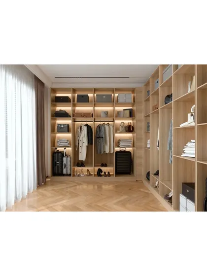 A well-organized space is the ultimate luxury. This custom walk-in wardrobe showcases our approach to smart storage, featuring natural wood finishes, integrated LED lighting to illuminate your collection, and ample shelving for clothing, accessories, and luggage.