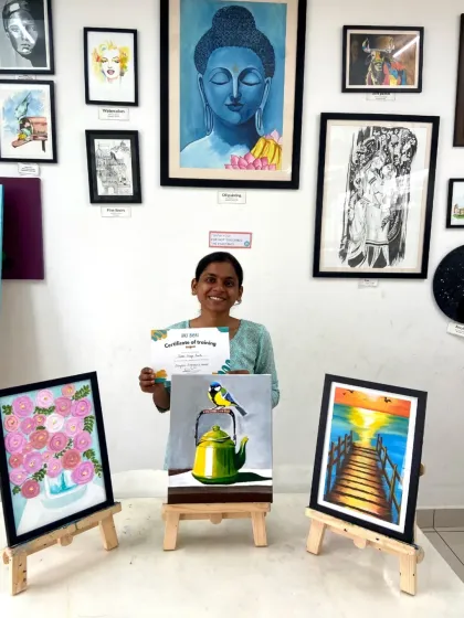 Another proud graduate of our acrylics course, with her beautiful paintings of a bird, a landscape, and a floral arrangement.