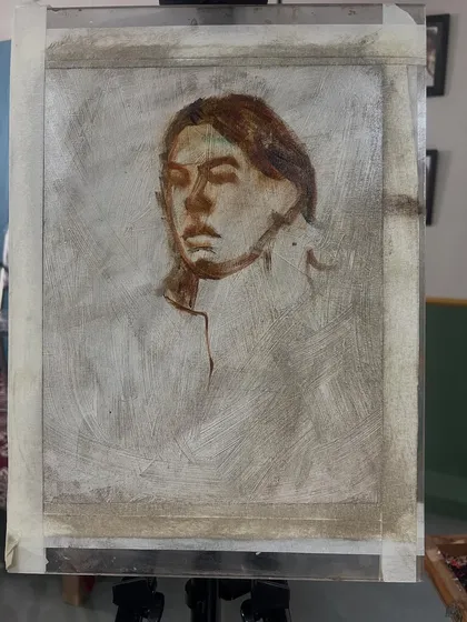 The underpainting stage for Mirra's portrait. I've established the basic shapes and dark tones before adding color. This is a crucial step in building a strong foundation for an oil portrait.
