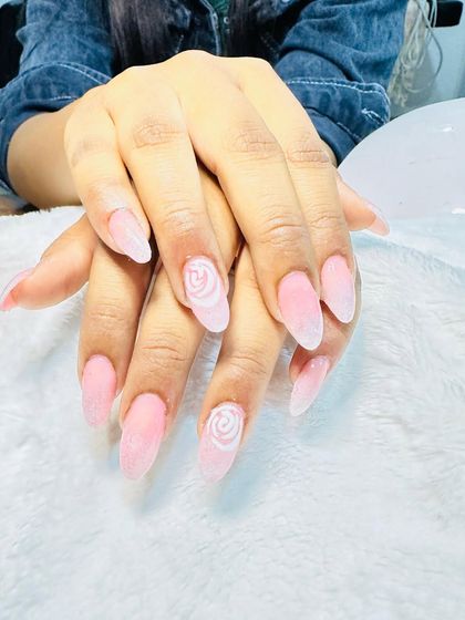 A soft and pretty design with a pink sugar-effect base and delicate hand-painted white roses.