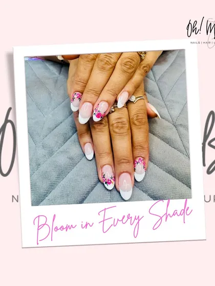 Bloom in every shade. This design combines a classic white French manicure with accent nails featuring a beautiful mosaic of hand-painted pink flowers.
