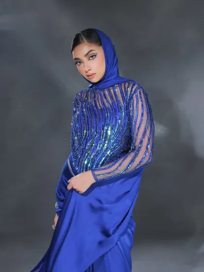 The full look with the electric blue liner. It's a monochromatic statement that is bold, confident, and perfect for a fashion-forward client.