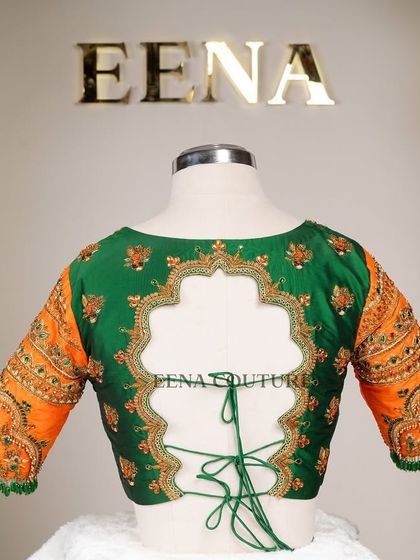 This blouse is a celebration of vibrant color and artistry. I used a rich green raw silk base and contrasted it with bright orange sleeves, which feature incredibly detailed peacock embroidery using zardozi, stones, and beadwork.