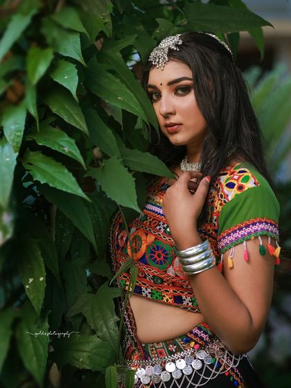 A vibrant and energetic series celebrating Navratri. The model is dressed in colorful Garba attire, and the photos capture the festive spirit through dynamic poses and joyful expressions.