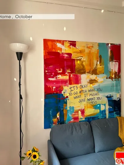 My studio space, with a vibrant abstract painting that reads, "It's okay to go after what you want. It might just want you too." A daily reminder to be bold.