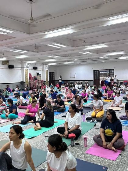 A wide shot of our large gathering for the International Yoga Day celebration, a testament to the growing and vibrant yoga community we are proud to be a part of.