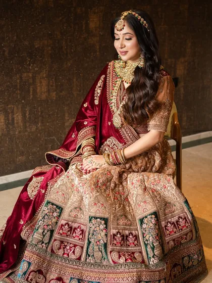 A full view of this royal bridal look. The rich velvet dupatta and heavily embroidered lehenga create a silhouette of pure elegance and grandeur.