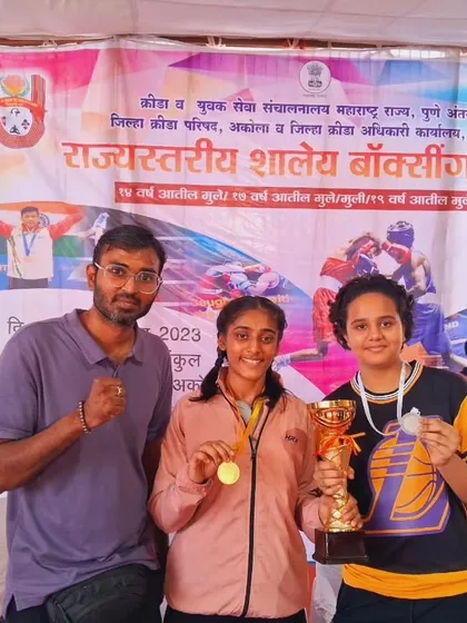 Coach with our state champions Nishi Patel (Gold) and Sanaya Yadav (Silver). We guide our fighters to the podium.