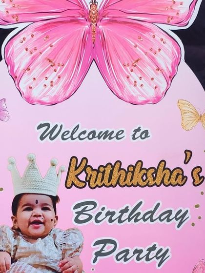 A personalized welcome sign for a butterfly-themed party, featuring a photo of the birthday girl.