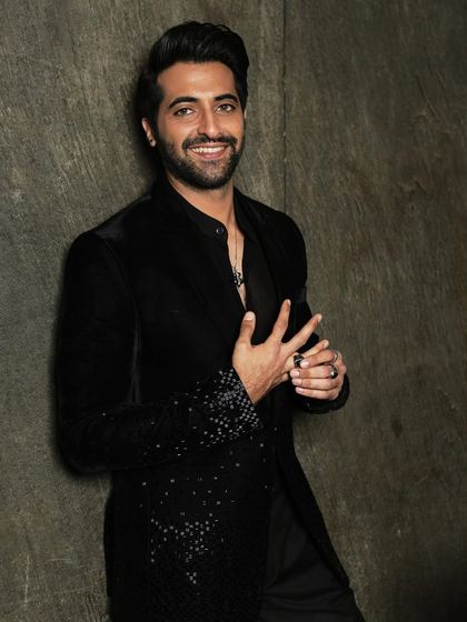 Another smiling shot that radiates confidence and charm, perfect for promotional use.