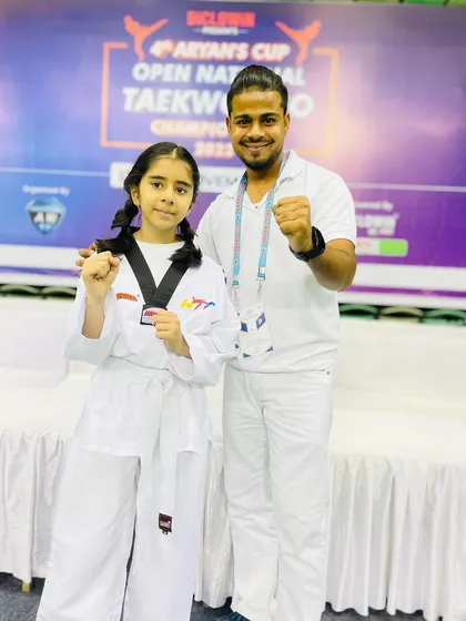 A moment of pride with my student after her win. Her success is my success, and I am incredibly proud of her achievement.