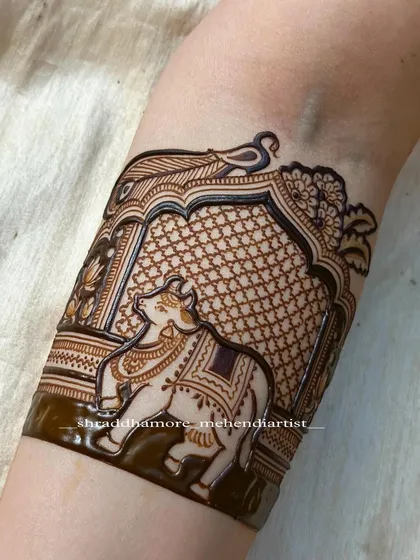 Incorporating sacred elements is a special part of my work. This arm band features a detailed depiction of Nandi, the sacred bull, framed within an ornate temple arch, symbolizing strength and devotion for the bride's new journey.