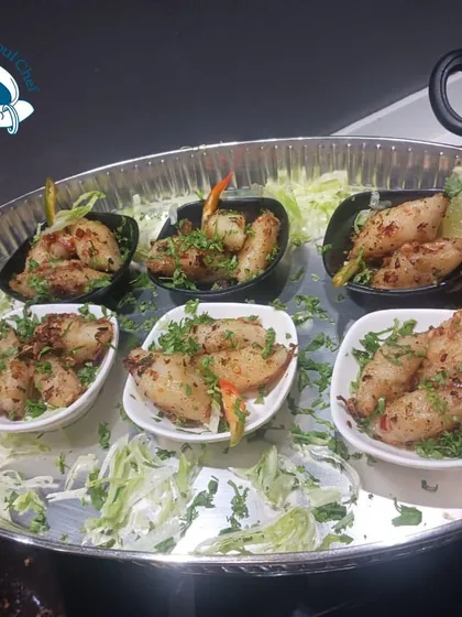 A tray of spicy calamari, perfect for seafood lovers.